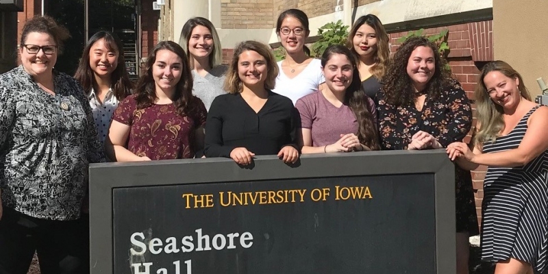 CSGP URA students in group photo in front of old Seashore Hall sign
