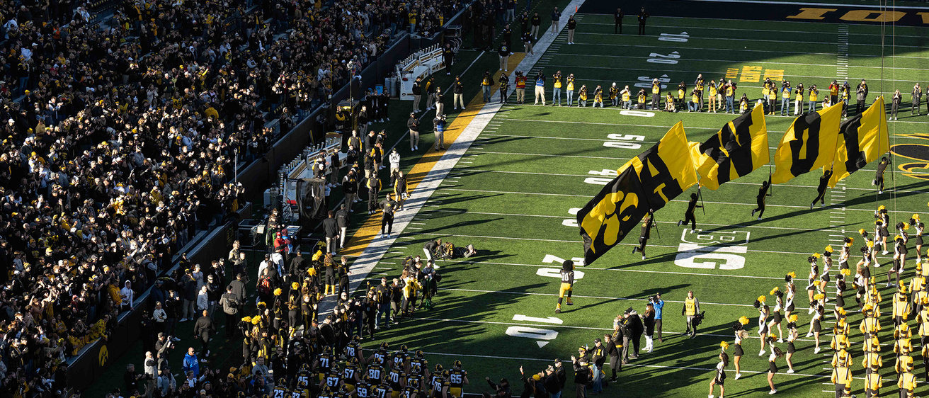 View of Hawkeye football team coming onto the field
